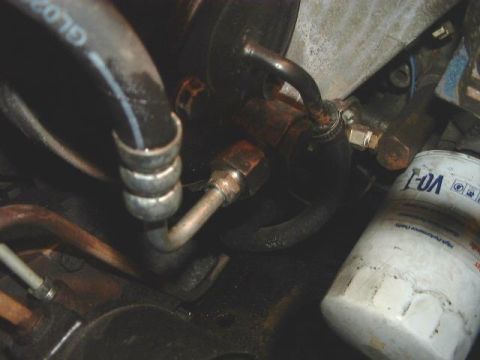 1986 Ford Bronco - This is a shot of the back of MY pump. The output is rotatable to align with the hose direction.