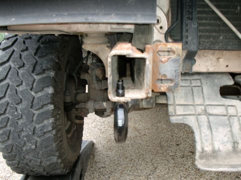 1996 Ford Bronco - Close-up view of the front tow hitch and tire of a 1996 Ford Bronco.