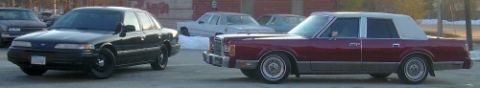 1989 Lincoln Town Car - This 1989 Lincoln Town Car is seen from the side, a two-tone paint scheme with a white vinyl roof.