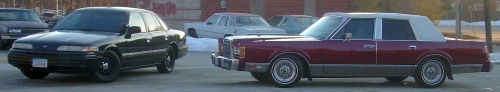 Maroon 1989 Lincoln Town Car, side view, with white vinyl roof
