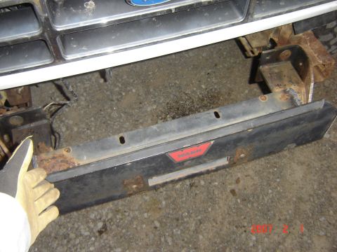 1993 Ford Bronco - The front bumper of a 1993 Ford Bronco shows signs of rust and has a WARN emblem.