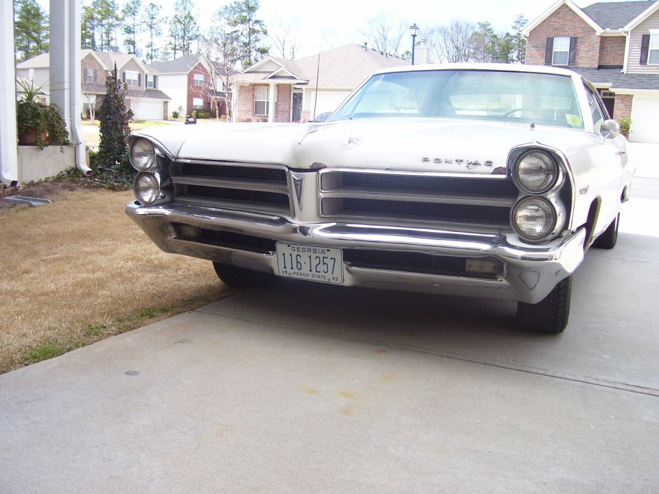White 1960s Pontiac hardtop front view with stacked headlights and Georgia plate