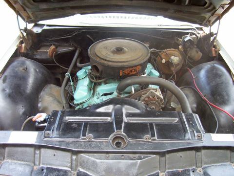 1965 Pontiac Catalina - Engine bay of a 1965 Pontiac Catalina, showing the V8 engine and associated components.