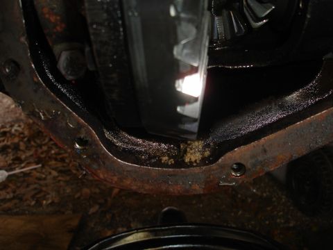 1989 Ford Bronco - The differential housing shows signs of wear and is covered in grease.