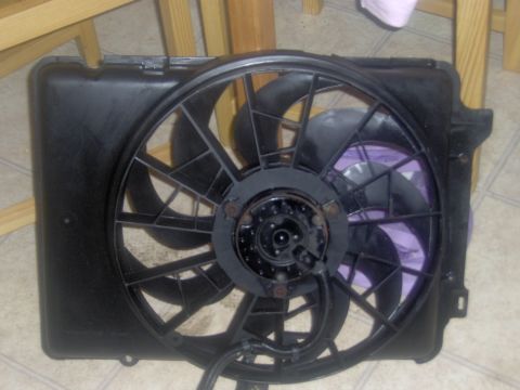 1968 Ford Mustang - This is a radiator fan assembly, not a 1968 Ford Mustang. The part is black with a central motor and visible wiring.