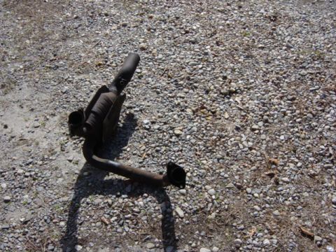 1991 Ford Bronco - Exhaust pipe and catalytic converter on the ground.