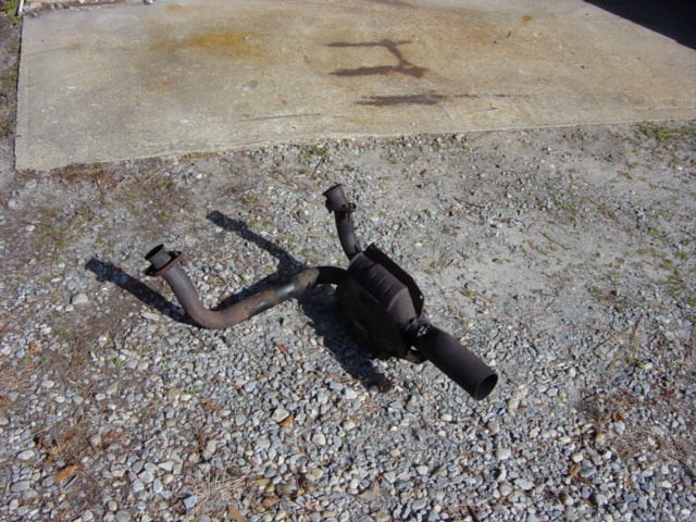 exhaust pipe and catalytic converter on gravel