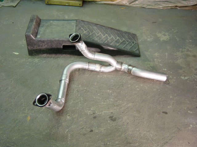 Fabricated dual-inlet Y-pipe exhaust section on a shop floor