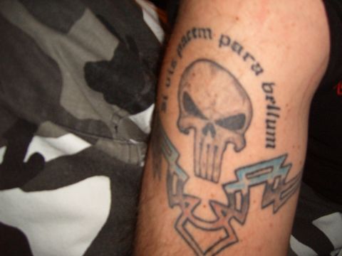 1993 Ford Bronco - A tattoo of a skull with the Latin phrase 'si vis pacem para bellum' is visible on an arm.