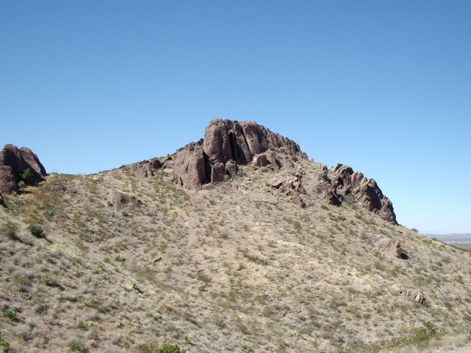 Rocky hillside under a clear blue sky