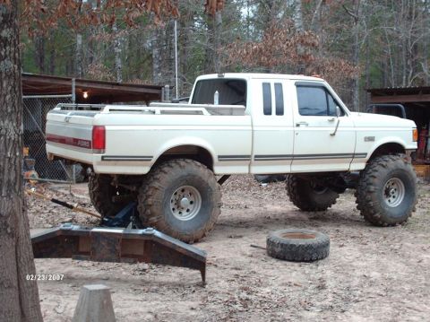 1990 Ford F-150 - This lifted 1990 Ford F-150 pickup truck is equipped with oversized tires for off-road use.