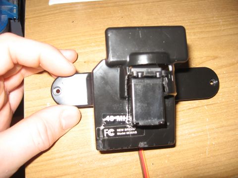 1990 Ford Bronco - A black receiver unit for a remote control car, labeled "40 MHz" and "NEW BRIGHT Model 6630AS".