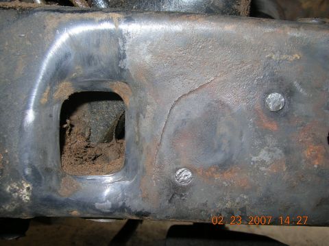 1991 Ford F-150 - Crack in driver side frame rail (again), to the rear of the steering box, behind factory TTB coil mounts.