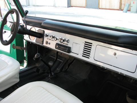 1975 Ford Bronco - Interior view of a 1975 Ford Bronco, showing the dashboard, steering wheel, and seats.