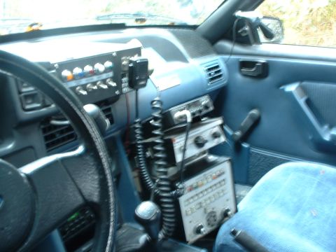 1987 Ford Mustang - Interior view of a 1987 Ford Mustang, equipped with various radio communication devices.