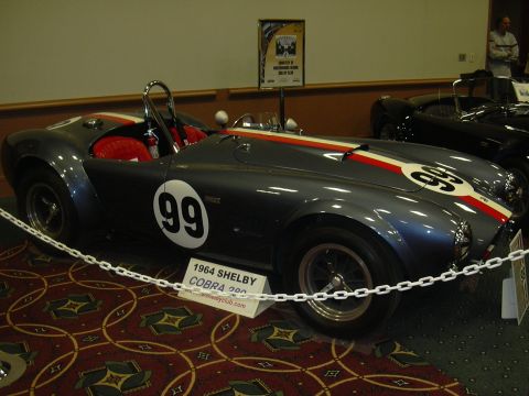 1996 Ford Crown Victoria - A 1964 Shelby Cobra 200 is displayed indoors, with another car visible behind it.