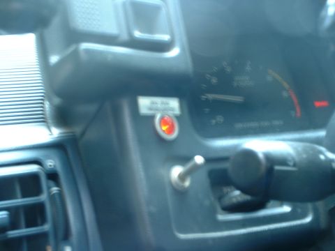 1987 Ford Mustang - Dashboard interior view with gauges and an aftermarket toggle switch installed.