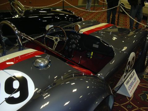 1996 Ford Crown Victoria - A 1964 Shelby Cobra 289 is displayed with racing stripes and the number 9 on its fender.