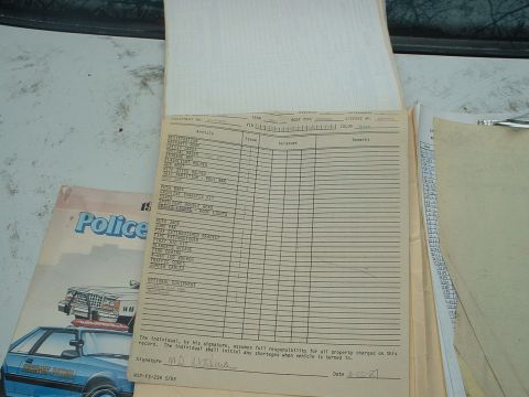 1987 Ford Mustang - A document detailing police vehicle equipment is shown alongside a diagram of a police car.