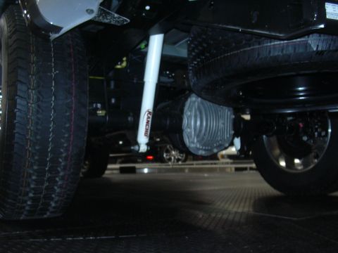 1996 Ford Crown Victoria - This image shows the underbody of a vehicle, highlighting the spare tire, differential, and a Rancho shock absorber. The registry informati…