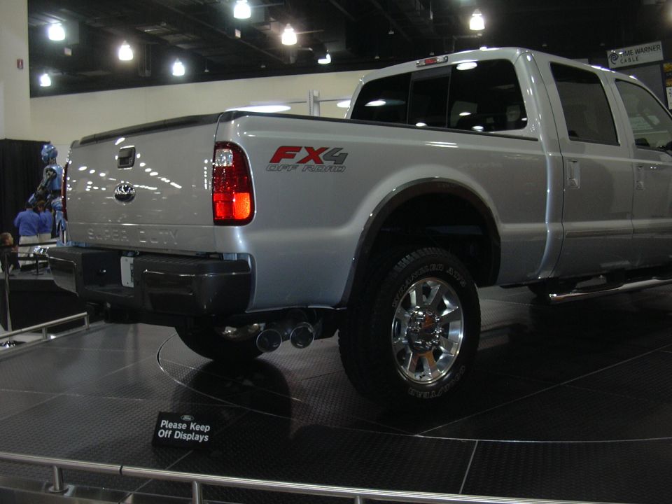 Silver Ford Super Duty pickup truck with FX4 Off-Road decal on the fender