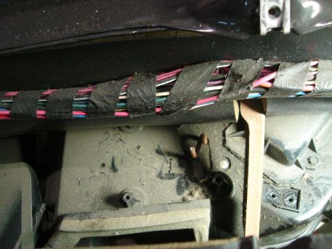 1992 Ford Crown Victoria - Interior view showing a bundle of colorful wires secured with black electrical tape.