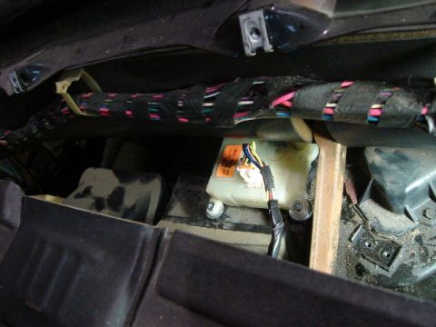 1992 Ford Crown Victoria - Close-up view of the vehicle's interior, showing electrical wiring and a fluid reservoir.