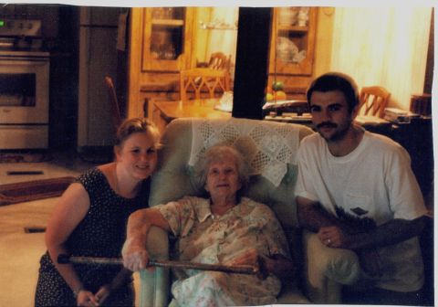 1986 Ford Bronco - A family gathers for a photo in a home setting, with an elderly woman seated in the center.