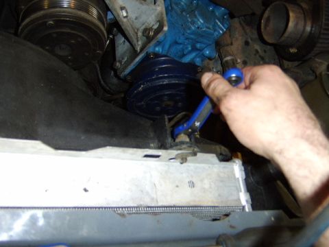 1989 Ford Bronco - After removing the fan shroud I removed the rad by removing the two bolts on the top and then removing the two bolts up top securing the ra…