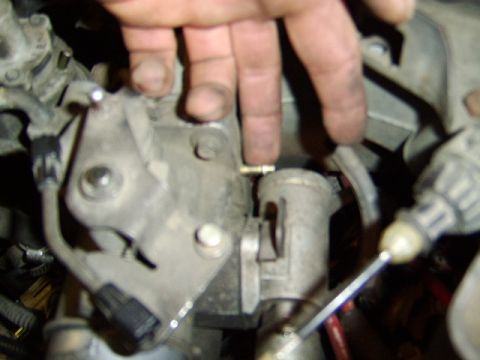 1989 Ford Bronco - then I removed the vacuum hoses from the throttle body. There is another one below this one.