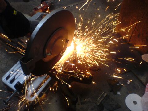 1967 Ford Bronco - A metal cutting grinder creates a shower of sparks during a fabrication process.