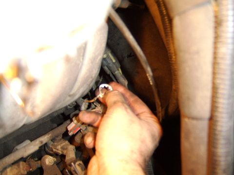 1989 Ford Bronco - there was a groung wire secured to one of the studs at the rear of the plenum. Also, don't forget to disconnect the PCV valve on the passen…