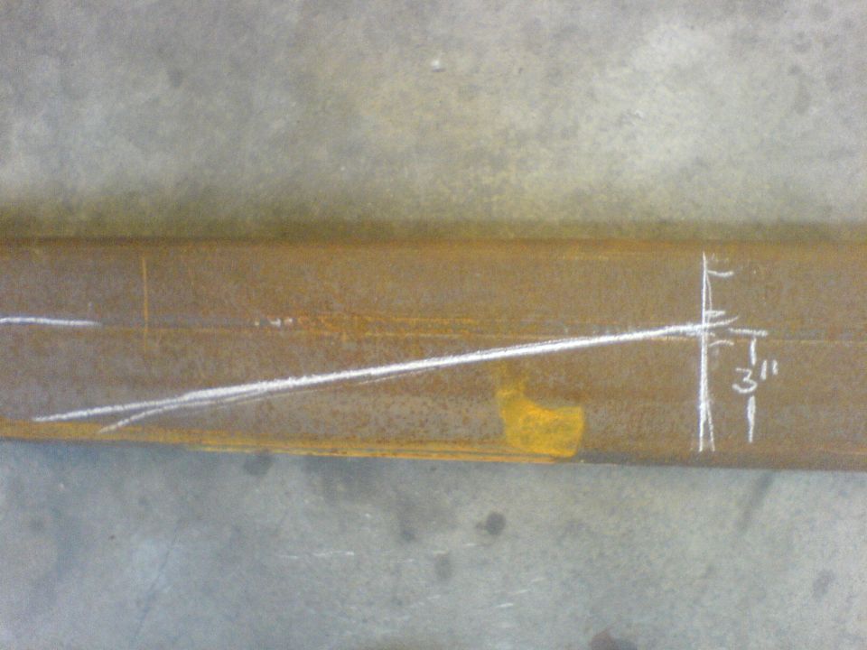 Metal beam with chalk lines and a "3" measurement mark