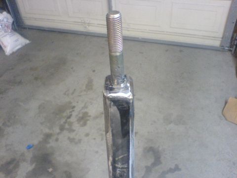 1967 Ford Bronco - A close-up view of a metal suspension component, likely undergoing restoration or repair.