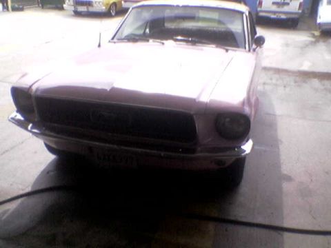 1988 Ford Bronco - This pink 1967 Ford Mustang is seen from the front, with a license plate that reads LMX 971.