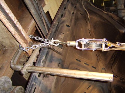 1989 Ford Bronco - this is how I am going to attempt to raise the motor in order to remove the oil pan. I secured one end of a come along to the rafter...