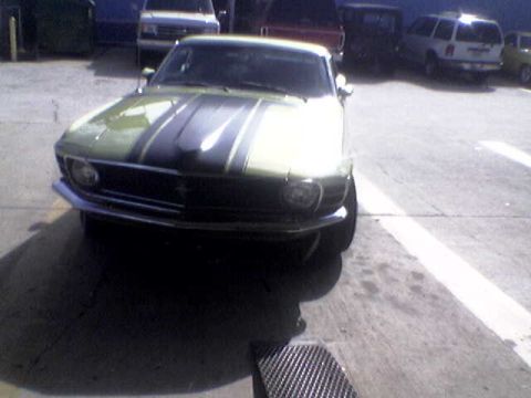 1988 Ford Bronco - Front view of a 1970 Ford Mustang with racing stripes.