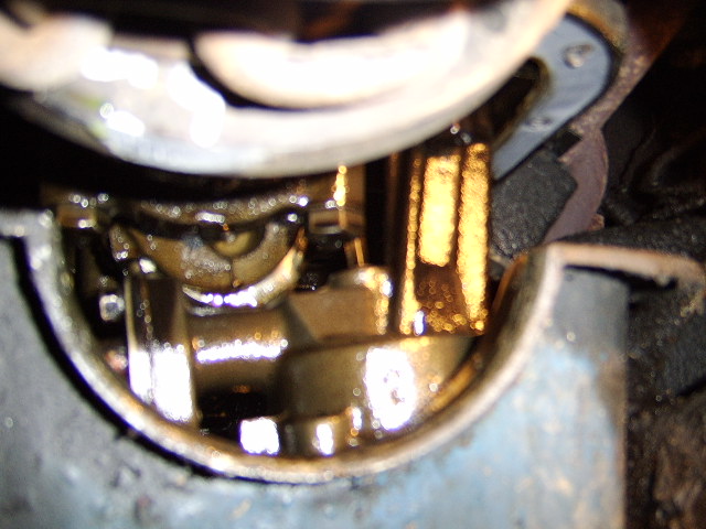 this is a shot of the oil pump and pick up tube which has to be removed before the pan can come out.