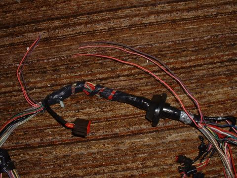 1986 Ford Bronco - This is a Spy photo I took of a NEW Ford EFI harness. These 4 wires were cutoff and taped over inside. Proof that this harness is not desig…