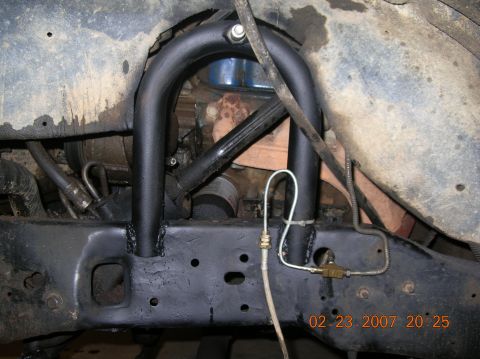 1991 Ford F-150 - Undercarriage view of a truck's frame, suspension, and engine area.