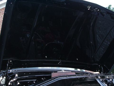 1966 Ford F-100 - Under the hood of a 1966 Ford F-100, revealing the engine and clean inner hood.