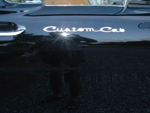 1966 Ford F-100 - Close-up of the 'Custom Cab' emblem on the side of a 1966 Ford F-100.