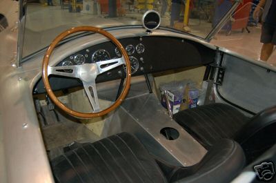 1965 Shelby Cobra - Interior view of a 1965 Shelby Cobra, showing the dashboard, steering wheel, and seats.