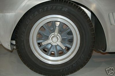 1965 Shelby Cobra - A close-up view of a wheel and tire on a vehicle under construction.
