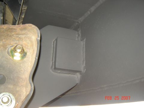 1990 Ford Bronco - Close-up of vehicle frame and suspension components, with a date stamp and website logo.