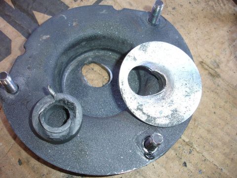 1993 Ford Taurus - This is a close-up of a vehicle's strut mount assembly, likely for suspension repair.