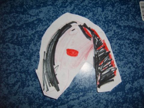 1993 Ford Bronco - A colorful drawing of a person's face, bold red lips and black hair, is placed on a blue speckled surface.