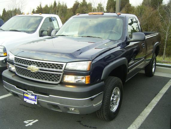 Dark blue Chevrolet pickup truck front 3/4 view