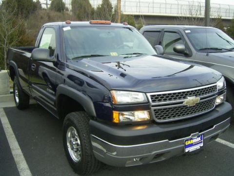 1994 Ford F-150 - Front view of a dark blue Chevrolet pickup truck with a CARMAX license plate frame.