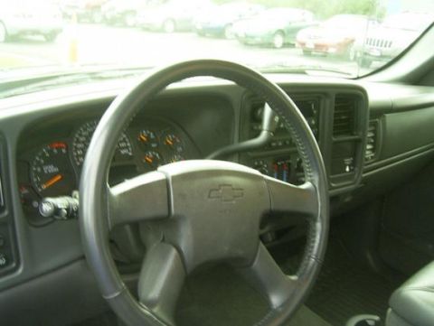 1994 Ford F-150 - The interior of a Chevrolet Silverado shows the dashboard, steering wheel, and gauges.